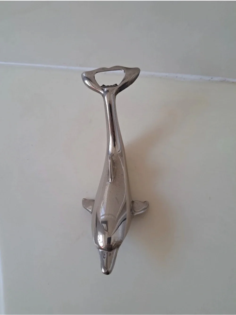Sleek silver-plated Dolphin bottle opener